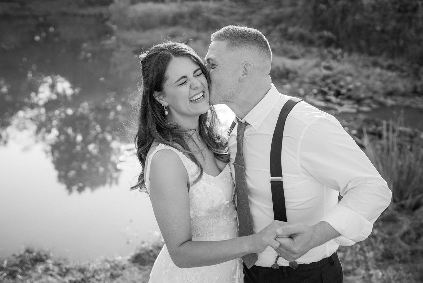 Best of 2025 a bride and groom laughing captured by a nottingham wedding photographer