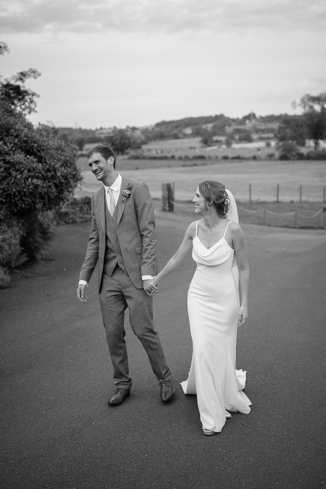 black and white photo of wedding couple laughing captured by nottingham photographer
